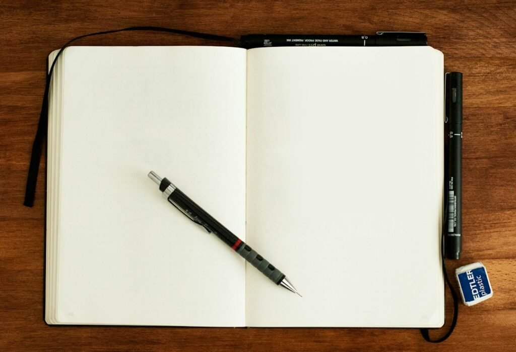 A side-by-side comparison of a drawing book and a sketchbook, showcasing their different textures, bindings, and paper types.