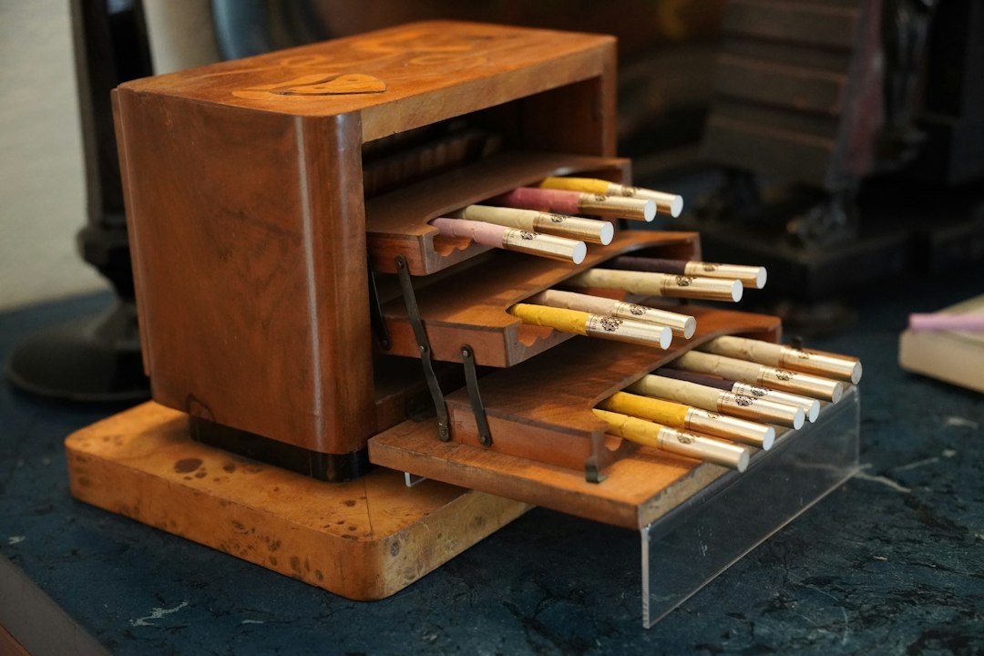 Cigarettes are stored in a wooden, tiered case